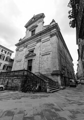 Naklejka premium Exterior view of San Martino Church next to La Loggia in Siena, Tuscany, Italy