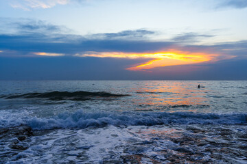 Tranquil Ocean Sunset With Vibrant Skies and Gentle Waves..