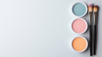 A white background with three different colored makeup containers