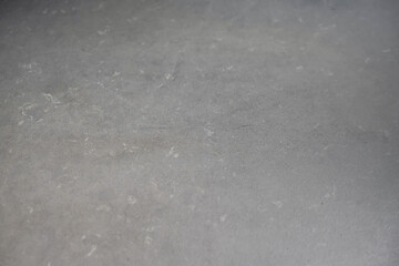 Flatlay of granite black stone surface for product and package background advertisment.