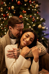 Fototapeta premium A couple shares laughter and warmth while celebrating Christmas in their beautifully decorated home.