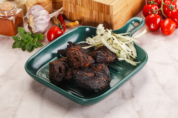 Grilled beef barbecue served onion