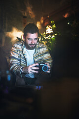 Photography, camera and man in home with laptop at night for digital editing, retouching and...