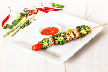 Thai Street foof satay with bacon and broccoli