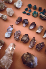 Marble, spiritual and gemstones with crystals in studio for holistic healing, aesthetic and reiki energy. Amethyst, rock minerals and chakra with jewels on background for balance, peace and geology