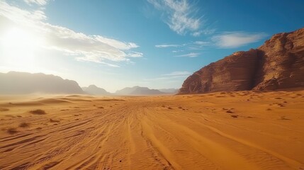 Naklejka premium breathtaking golden desert sands stretch beneath a brilliant blue sky, where sunlight bathes the landscape in warmth, creating an inviting and serene morning scene
