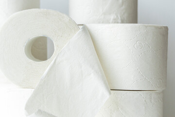 Many toilet paper rolls on white background. soft hygienic paper. close up