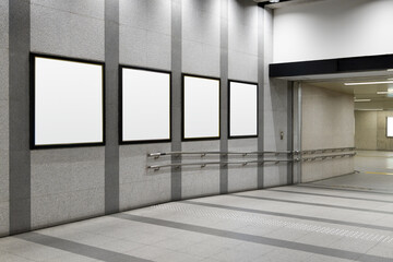 Four squares blank billboard advertising poster on a subway station hall. Space for text for...