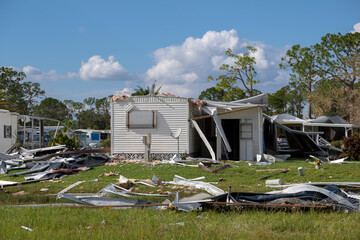 Badly damaged mobile homes after hurricane in Florida residential area. Consequences of natural...