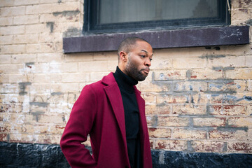 Fashion portrait of black man in city in modern spring or fall season outfit.