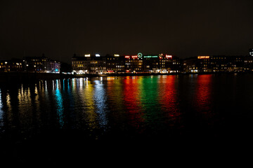 Obraz premium Nightview of Sortedam lake (Sortedams sø) and neon light advertisement billboards in Copenhagen, Denmark.