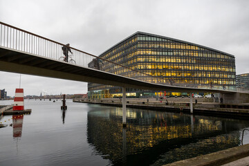 Cyclist crossing Cykelslangen in Copenhagen. 