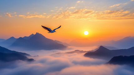Fototapeta premium A lone bird soars high above a misty valley at dawn, symbolizing freedom and serenity against.