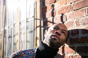 Fashion portrait of black man in city in modern spring or fall season outfit.