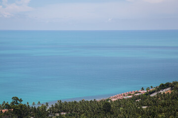 Naklejka premium In the distance you can see the sea and the coast surrounded by jungle