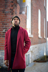 Obraz premium Fashion portrait of black man in city in modern spring or fall season outfit.