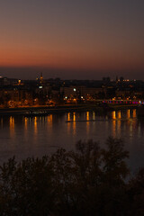 Fototapeta premium Panorama of Novisad on the Danube after the red sunset