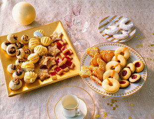 Festive Platter With Christmas Cookies And Pastries. A delightful array of cookies and pastries arranged on elegant plates, perfect for a festive gathering or holiday celebration.