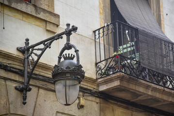 vintage street lamp in Barcelona next to a balcony