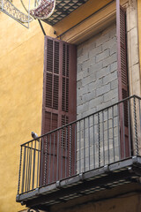 Balcony with a window that has been sealed with a wall of concrete bricks