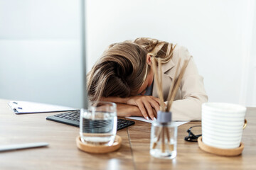 Laptop, sleep or tired woman in office with burnout, documents or tax, audit and deadline mistake....