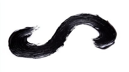 Black paint swirl on a white isolated background for creative design.