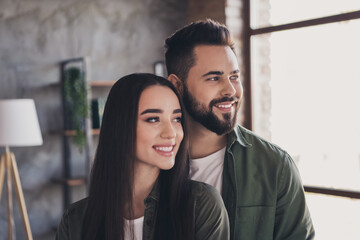 Photo of two young attractive loving people buy rent flat modern loft interior indoors living together