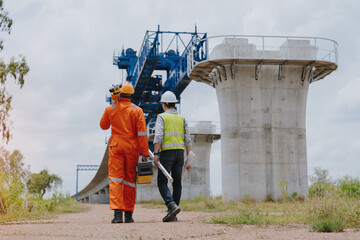 Surveying engineers take measurements with theodolite instruments at construction sites. Surveyors...