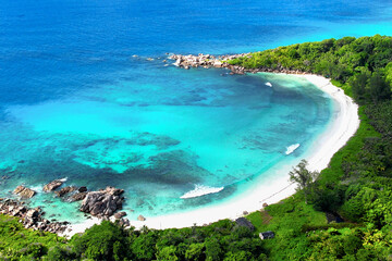 White beach and turquoise waters of Indian Ocean, aerial view. Summer vacation relaxation or recreation