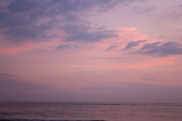 a purple and pink sky with a purple and purple sunset