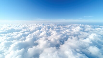 A bright blue sky filled with fluffy white clouds stretching into the horizon, creating a serene and tranquil atmosphere.