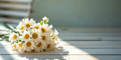 Obraz premium Concept photo of white daisies flower bouquet on light wooden table with space for text