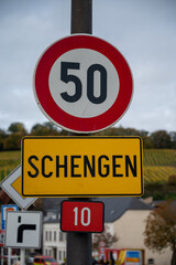 Entering in small wine-making village in Luxembourg on river Moselle, border includes tripoint borders of Germany, France, Luxembourg, place of signing of Schengen Agreement