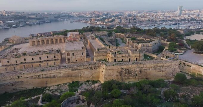 Aerial view of Fort Sant Elmo in Valletti, Malta. The historical architecture of the ancient fortress on the shore of the Mediterranean Sea. High quality 4k footage