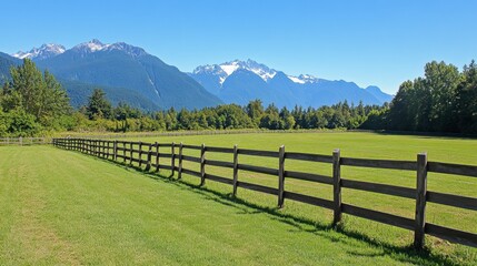 Scenic Mountain Landscape with Green Field and Fence