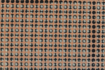 oxidized metal plate with circular perforations or holes