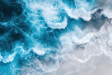 Fototapeta premium Ocean waves from above, displaying swirling foam and deep blues.