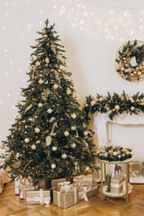 Christmas tree decorating with golden ornaments and gifts underneath