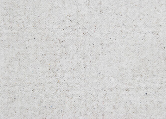 A sheet of gray spotted recycled craft paper texture as background