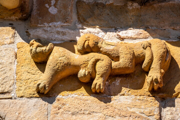 couple of lions hugging, Church of San Cipriano de Bolmir, Romanesque temple from the 12th century, Bolmir village, Campoo de Enmedio, Cantabria, Spain © Tolo