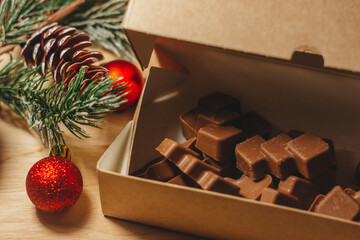 Dubai chocolate sits in a craft box next to the Christmas decor