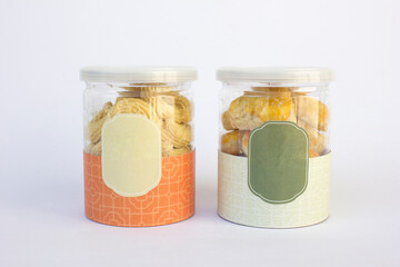 Some cookies in a transparent jar that is labeled. These cookies are a wedding gift. Usually consumed in the afternoon with tea.