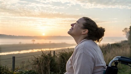 Woman in a wheelchair enjoying the sunset by the beach, symbolizing freedom, serenity, and connection to nature in an accessible setting.