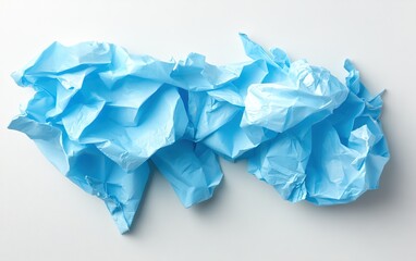 Obraz premium A crumpled sheet of blue paper lying on a flat surface, showcasing texture and color contrast against the plain background.