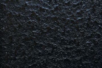 Black rough stone texture as background