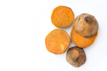 Sliced sweet potatoes isolated on a white background. Sweet potatoes are a highly nutritious root vegetable known for their sweet flavor and versatility in cooking. 