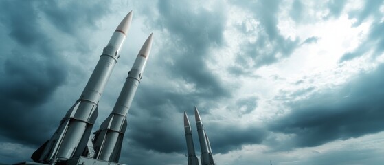 Dramatic stormy sky over towering missiles, creating an imposing atmosphere of tension and power as they stand poised against the swirling clouds.