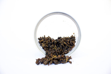 Close-up photo of a a jar of herbal tea on a white background. Detox and immunity drink.