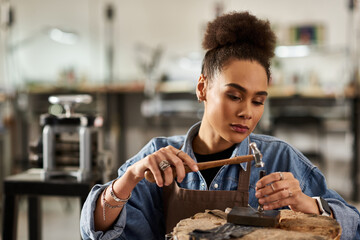A talented artisan meticulously shapes a jewel, showcasing passion for craftsmanship.