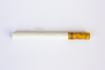 A cigarette isolated on white background. Smoking is the leading cause of lung cancer, responsible for approximately 90% of lung cancer deaths. 